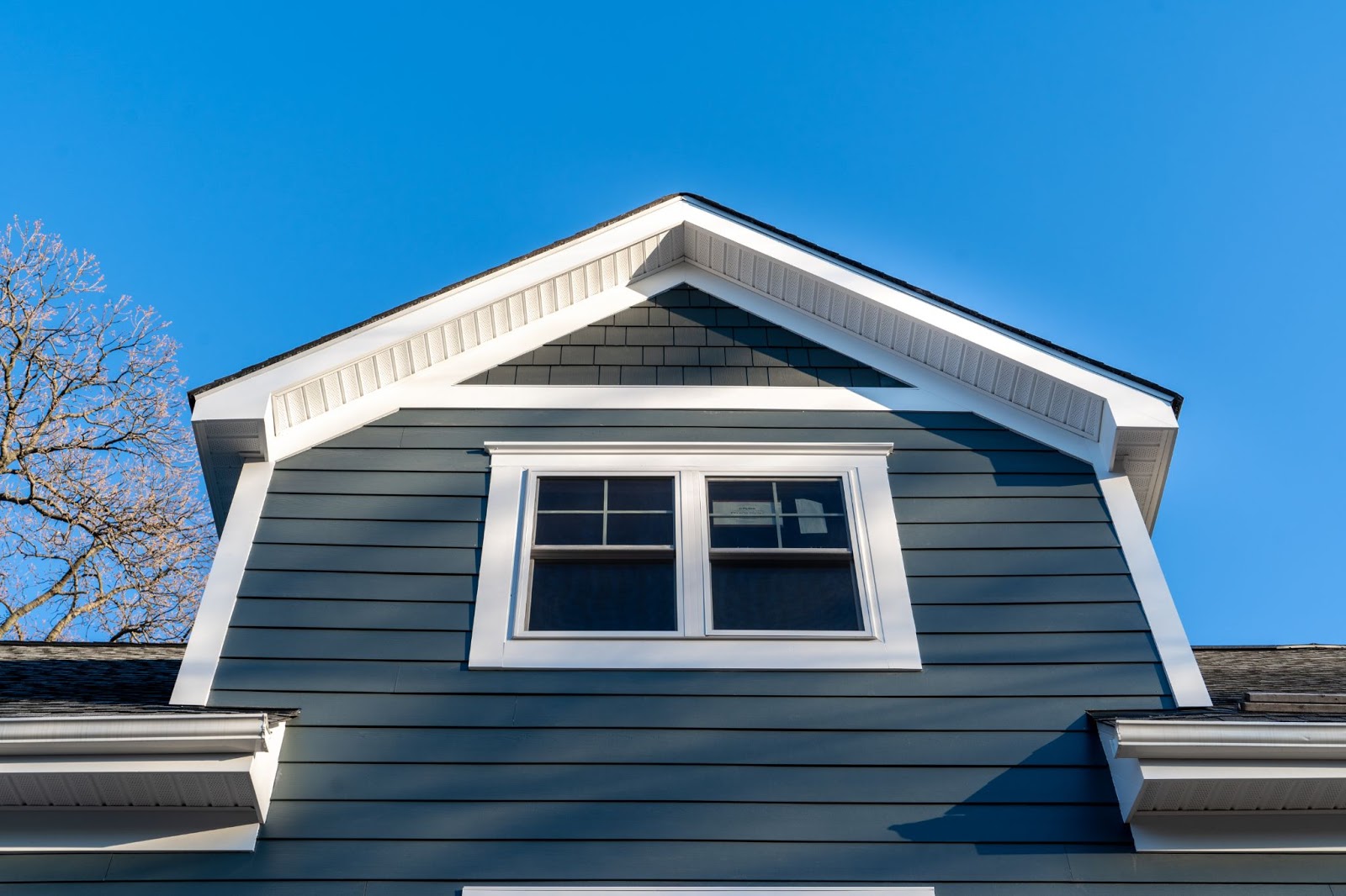 Photo of the second floor of a house with vinyl double hung windows