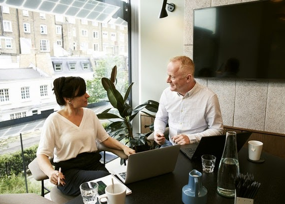 A man and a woman in a meeting