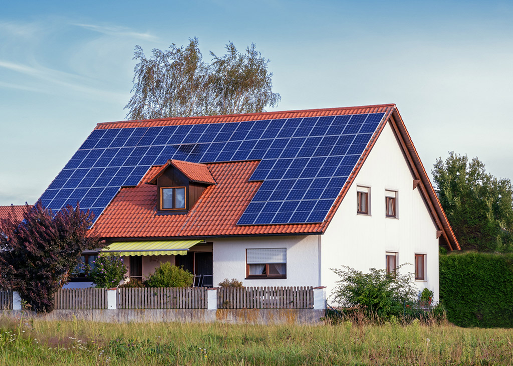 An eco-friendly home is covered in solar panels